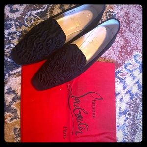 Christian Louboutin’s black flats